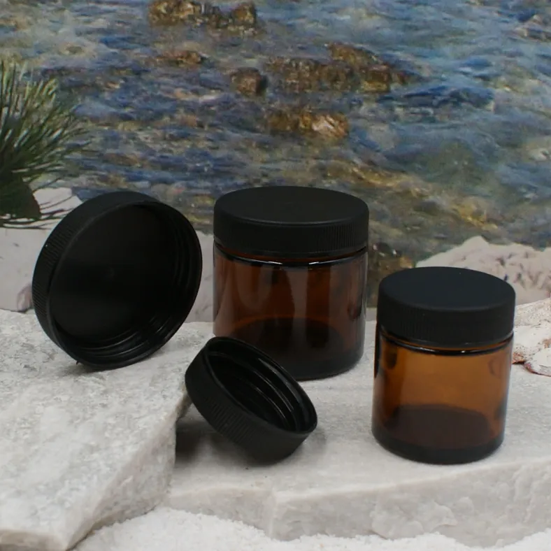 Braunglas Salbentiegel mit schwarzem Deckel